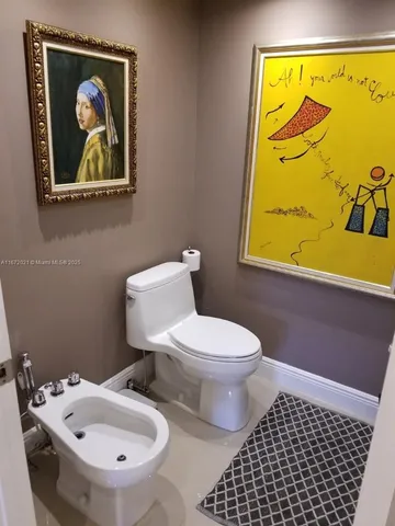 a bathroom with a toilet and a sink