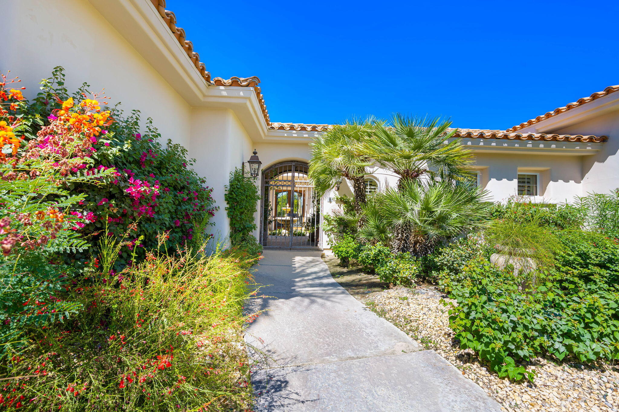 79290 Cetrino La Quinta, CA 92253 - Photo 15 of 74 a front view of a house with a yard