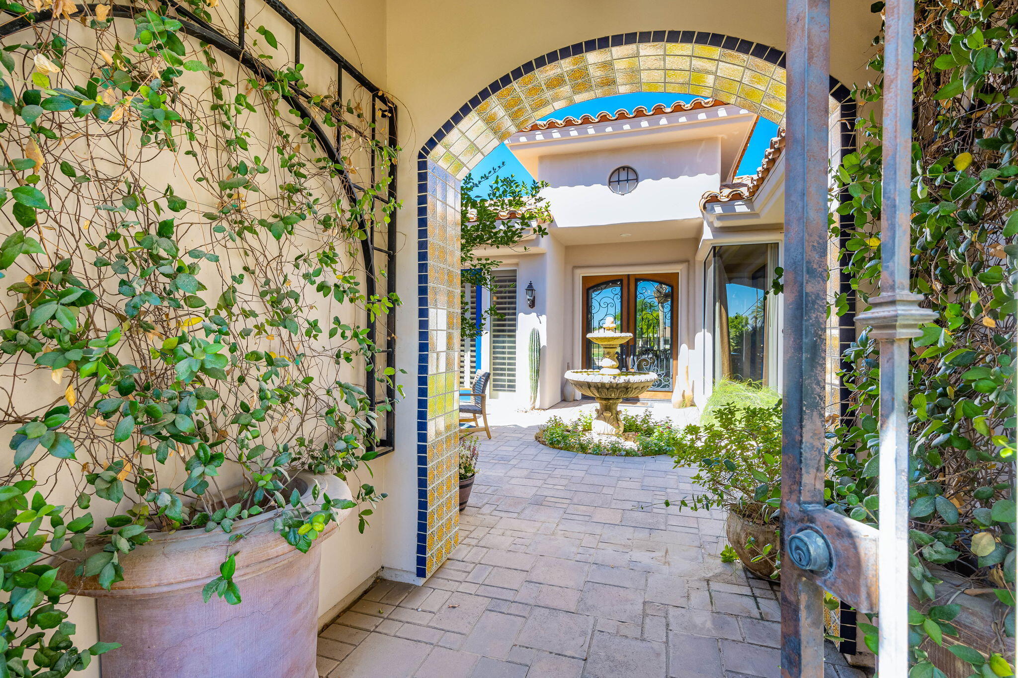 79290 Cetrino La Quinta, CA 92253 - Photo 16 of 74 a front view of a house with garden