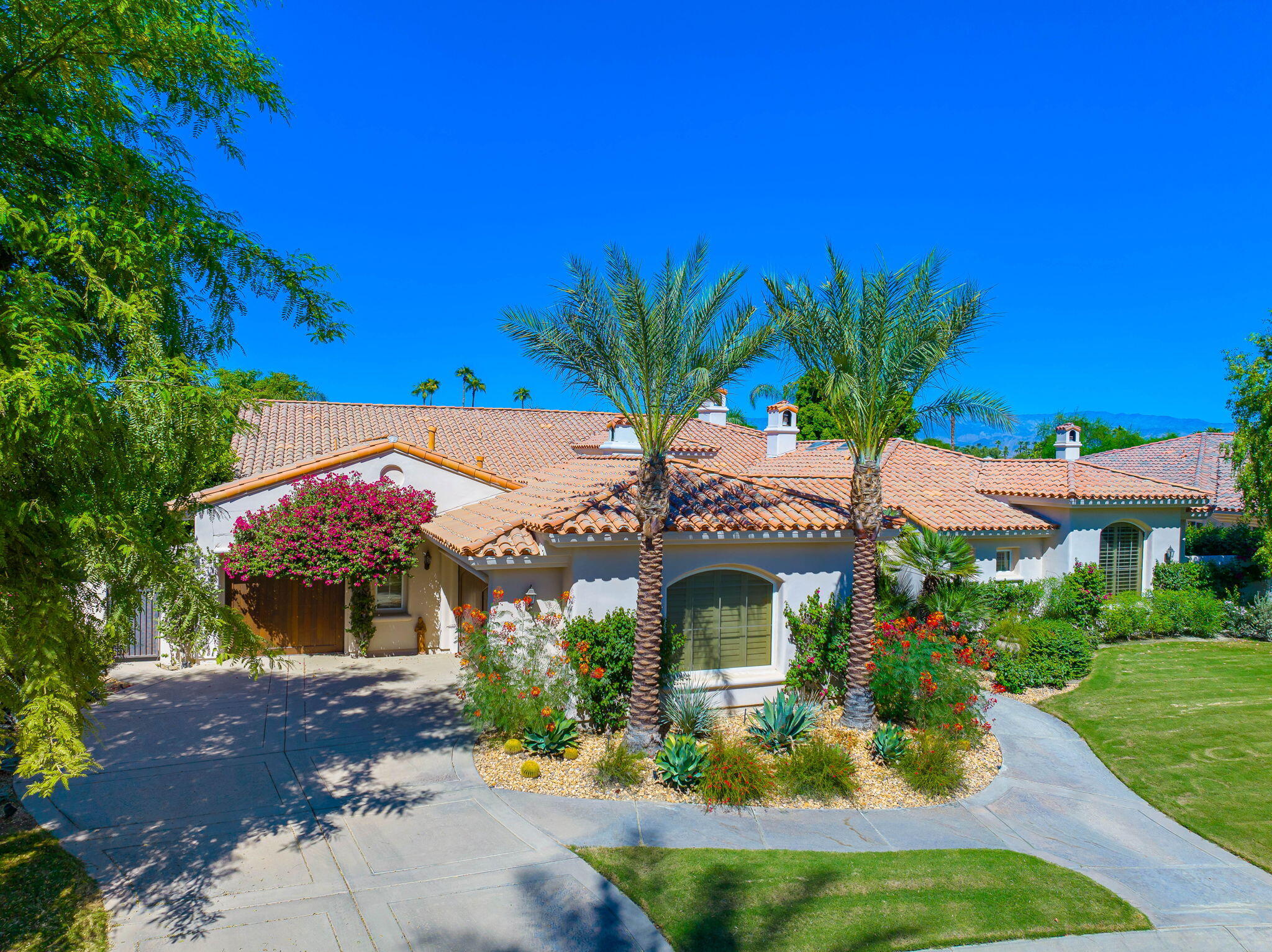 79290 Cetrino La Quinta, CA 92253 - Photo 2 of 74 a front view of a house with a yard