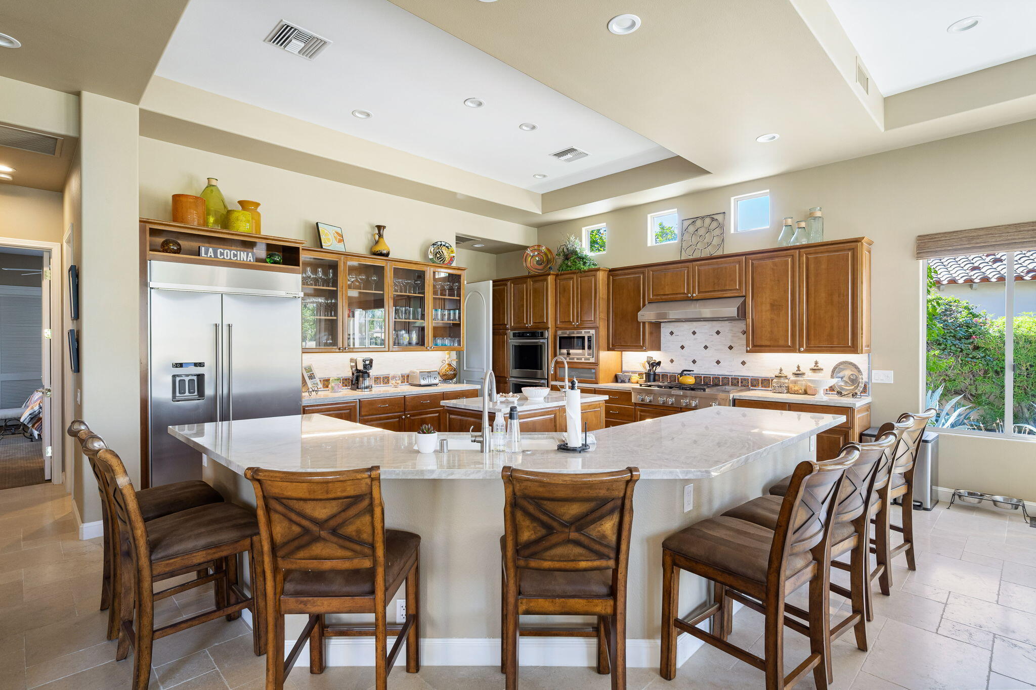 79290 Cetrino La Quinta, CA 92253 - Photo 25 of 74 a dining area with stainless steel appliances kitchen island a table and chairs