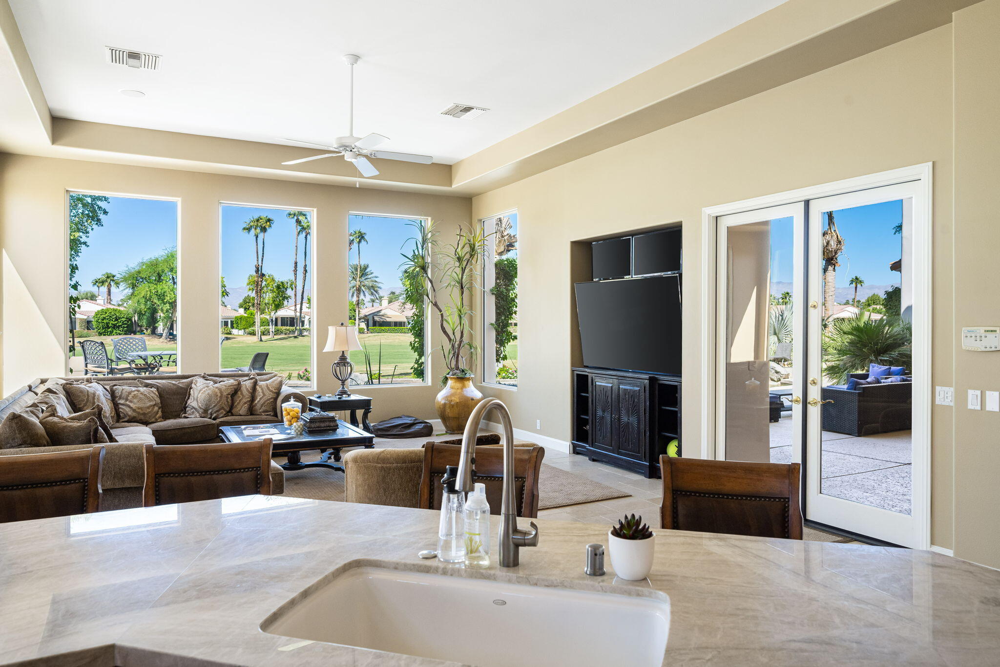 79290 Cetrino La Quinta, CA 92253 - Photo 30 of 74 a living room with furniture large window and flat screen tv