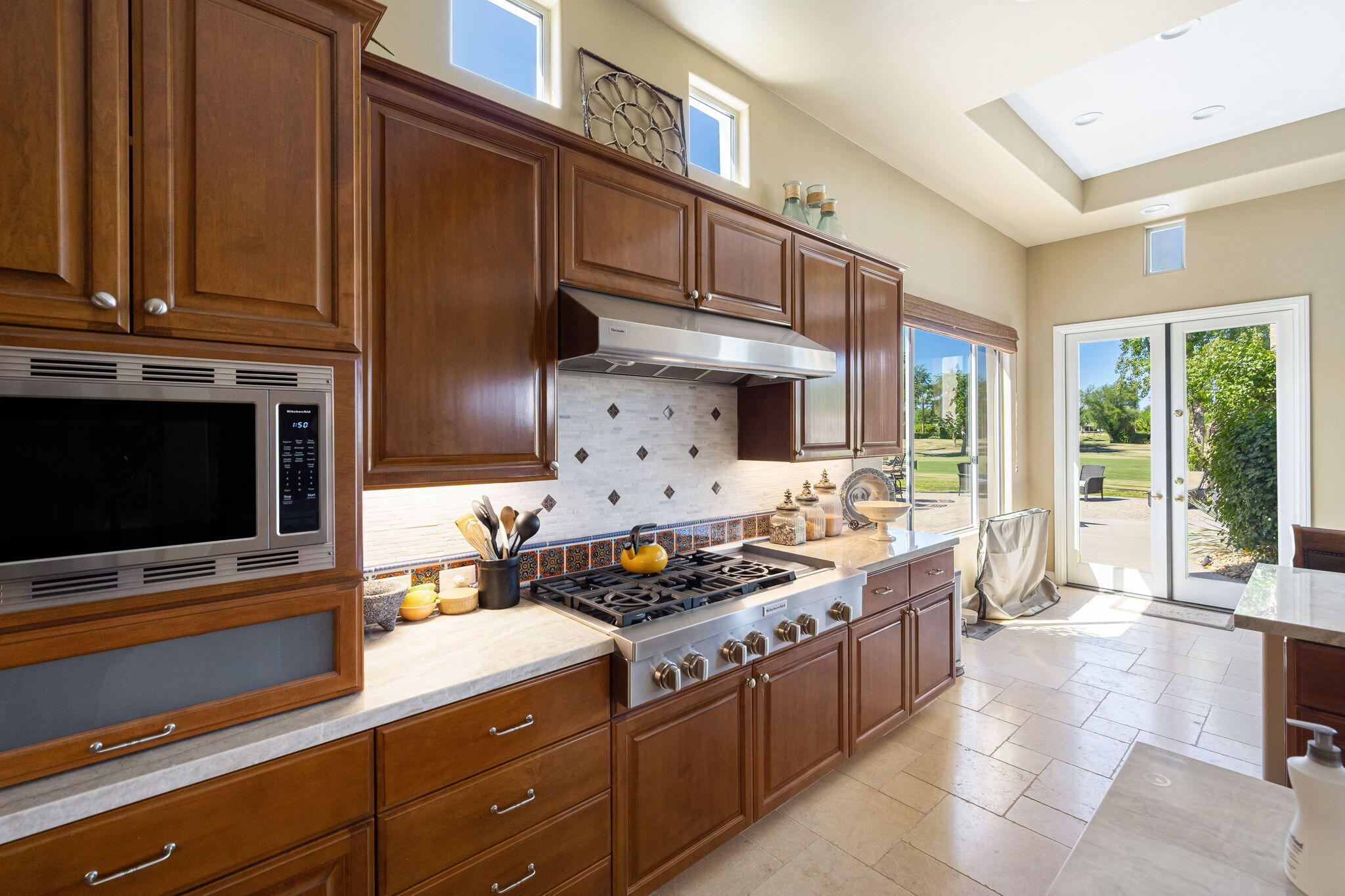 79290 Cetrino La Quinta, CA 92253 - Photo 32 of 74 a kitchen with stainless steel appliances a stove and a microwave