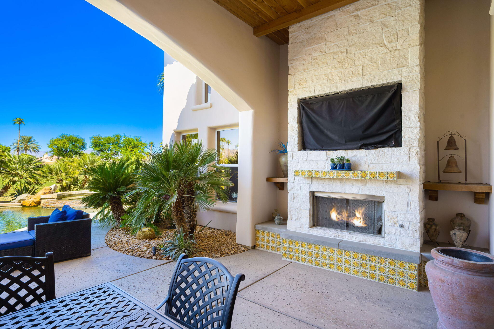 79290 Cetrino La Quinta, CA 92253 - Photo 35 of 74 a living room with furniture and a fireplace