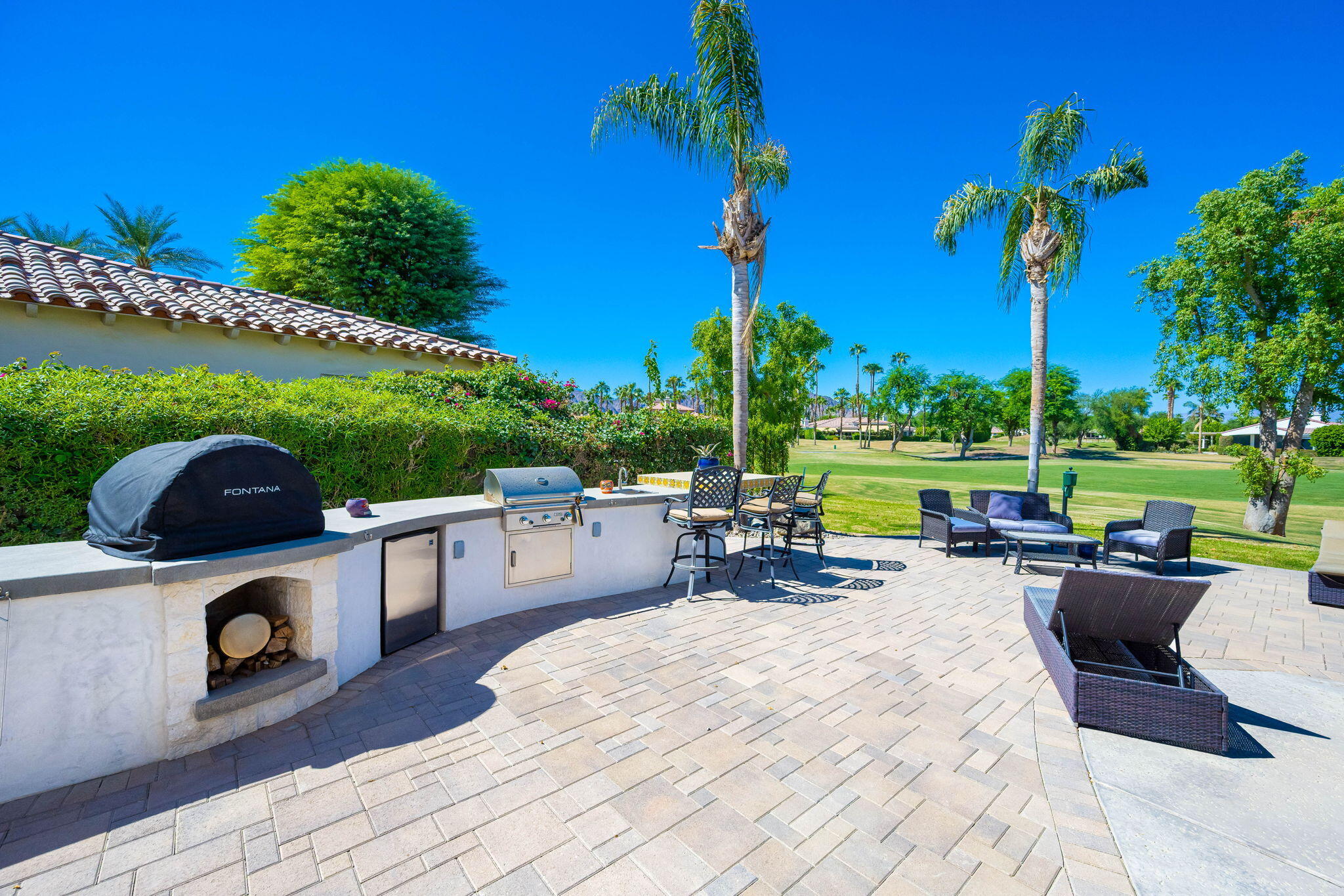 79290 Cetrino La Quinta, CA 92253 - Photo 48 of 74 a view of a patio with swimming pool table and chairs