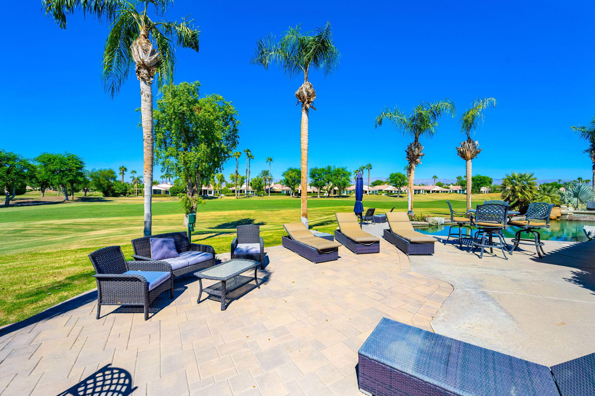 79290 Cetrino La Quinta, CA 92253 - Photo 49 of 74 a view of a swimming pool and lounge chairs