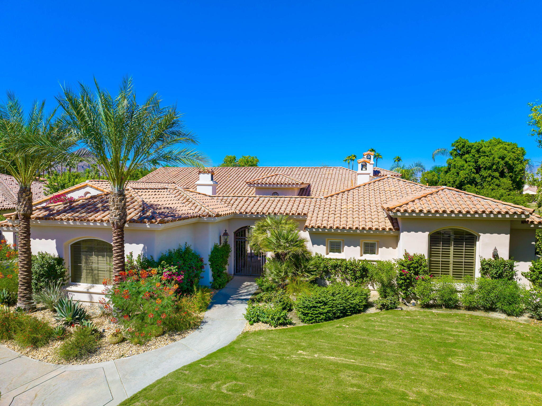 79290 Cetrino La Quinta, CA 92253 - Photo 5 of 74 a front view of a house with a garden