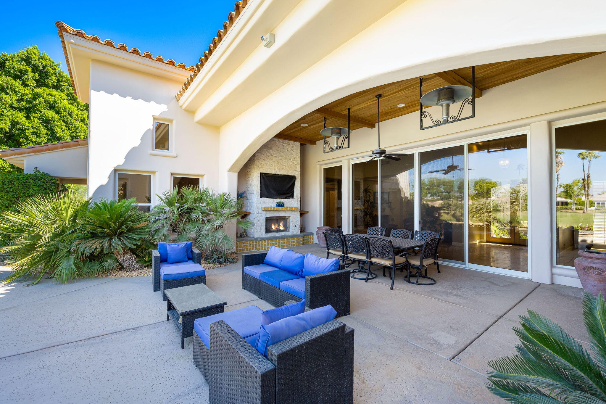 79290 Cetrino La Quinta, CA 92253 - Photo 52 of 74 a outdoor space with patio the couches and a dining table with the view of the house