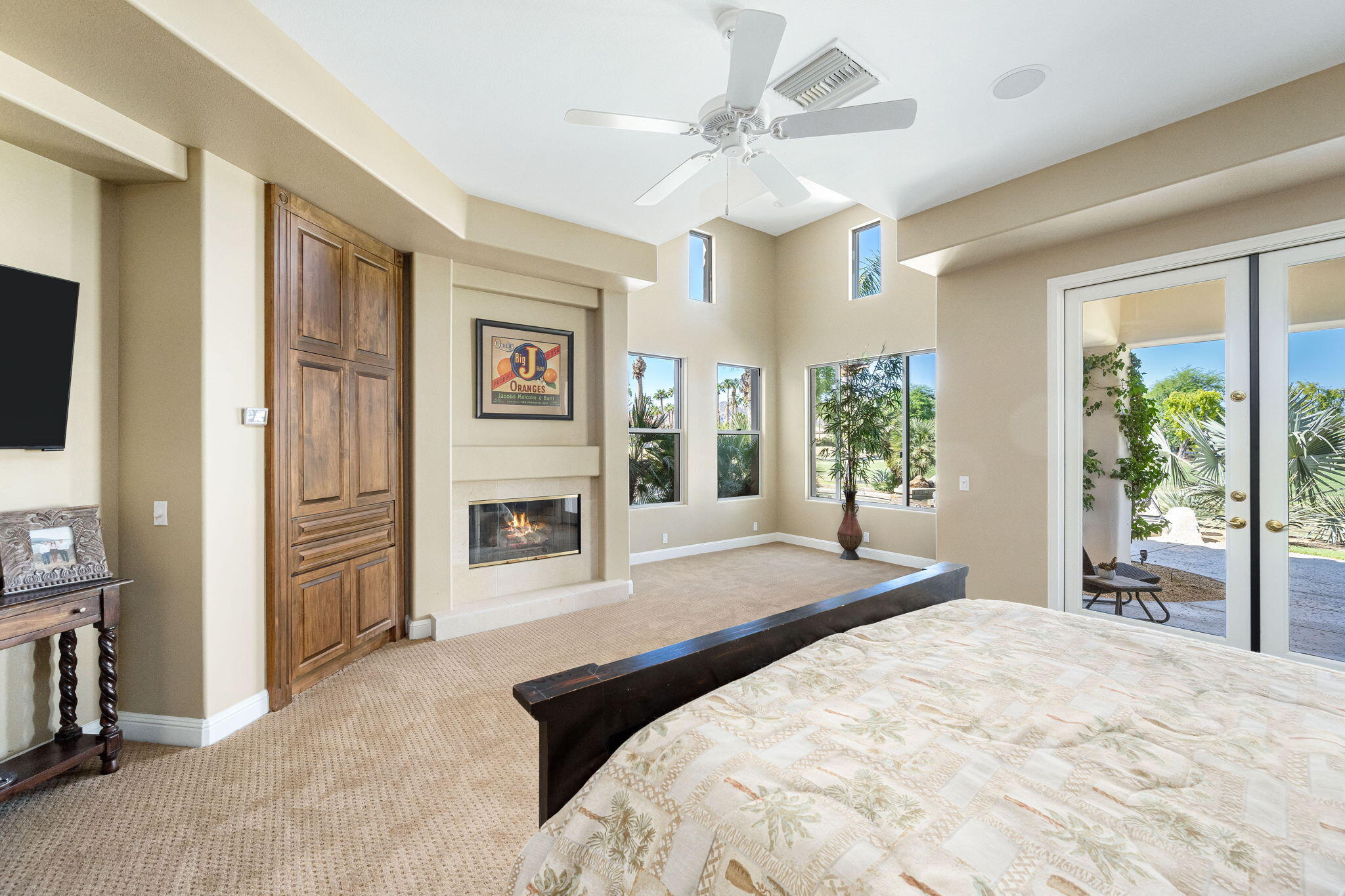 79290 Cetrino La Quinta, CA 92253 - Photo 59 of 74 a spacious bedroom with a bed and a flat screen tv