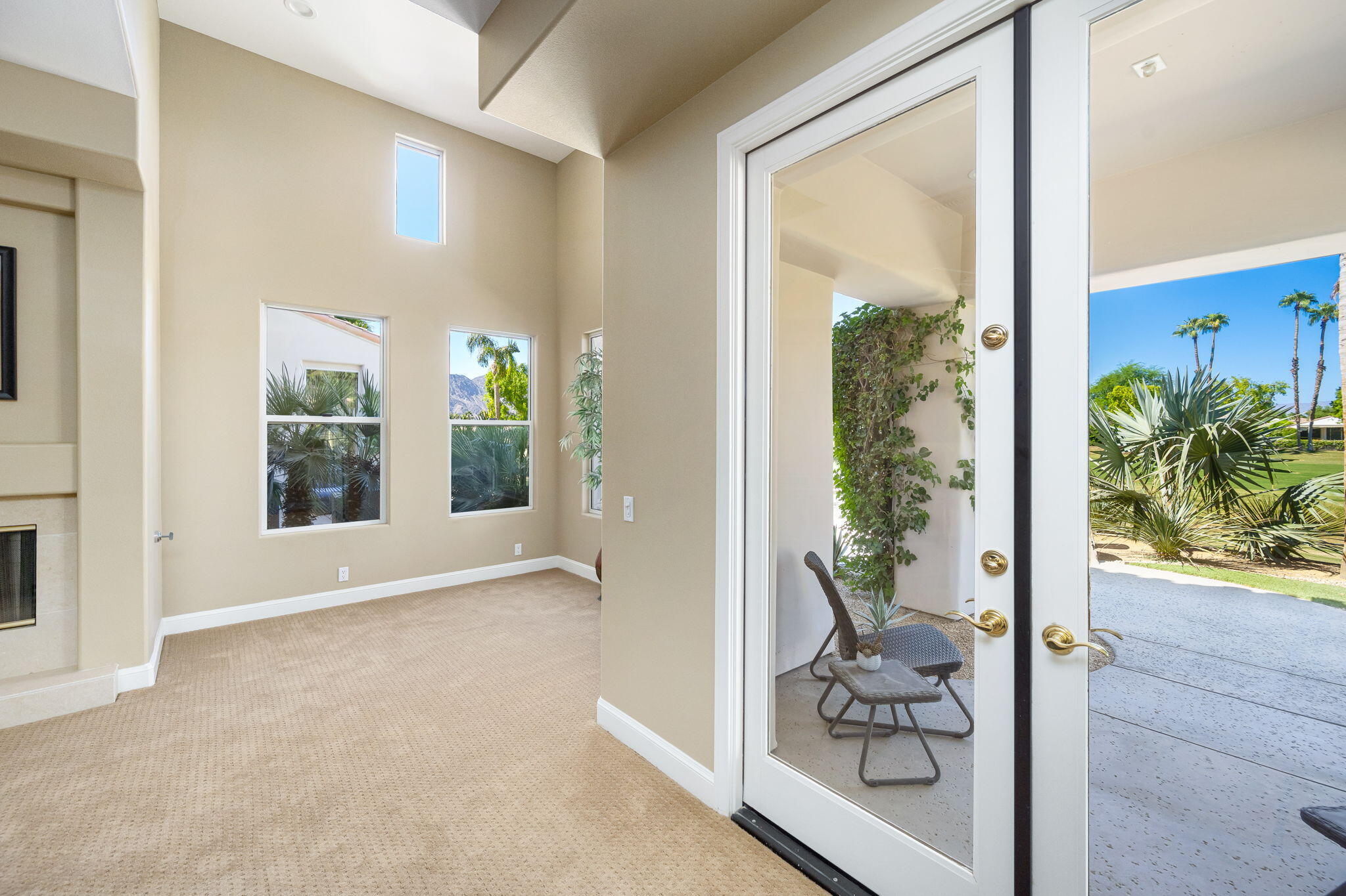79290 Cetrino La Quinta, CA 92253 - Photo 60 of 74 a view of a hallway with wooden floor and a potted plant