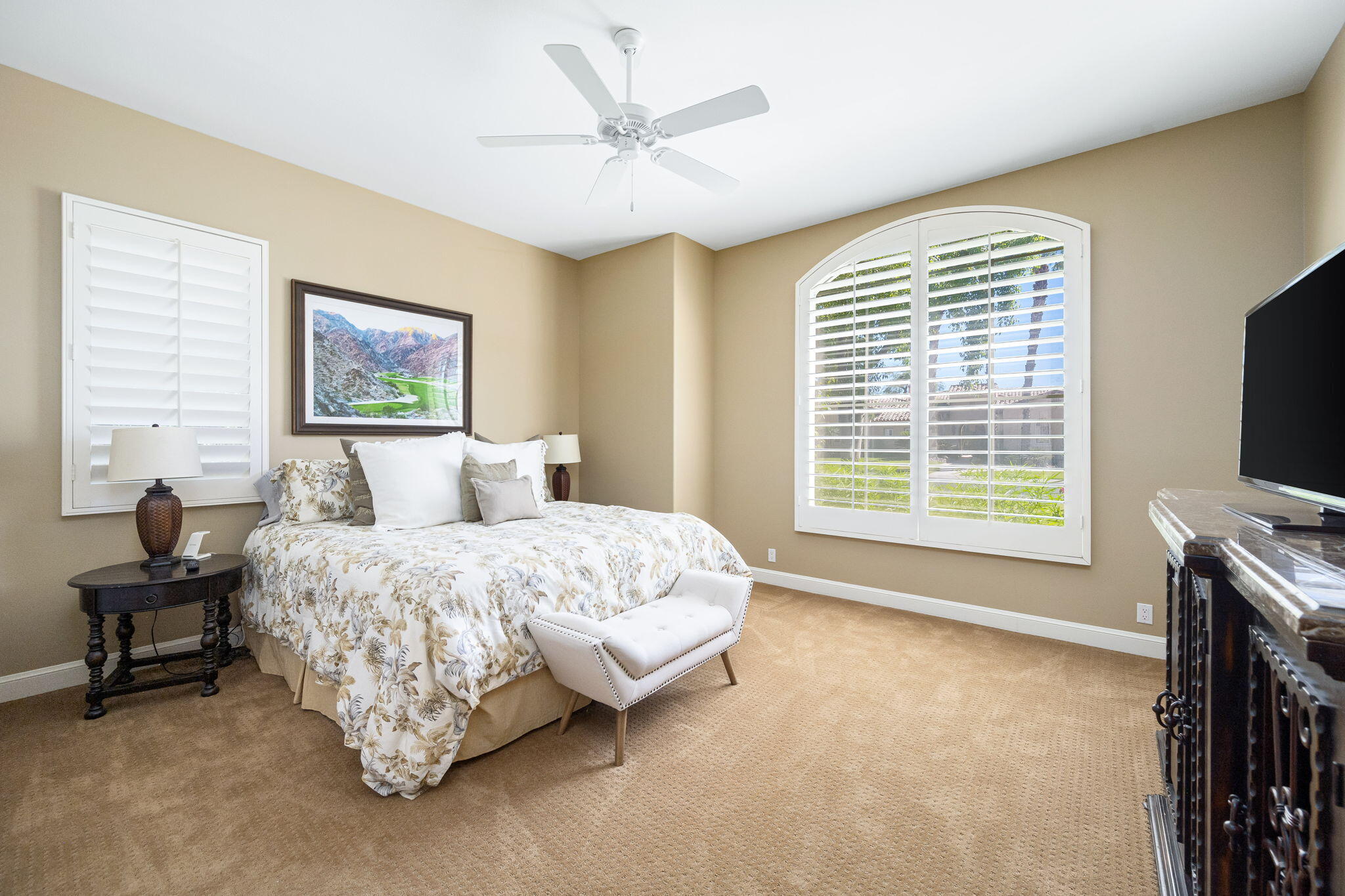 79290 Cetrino La Quinta, CA 92253 - Photo 64 of 74 a spacious bedroom with a bed and a flat screen tv