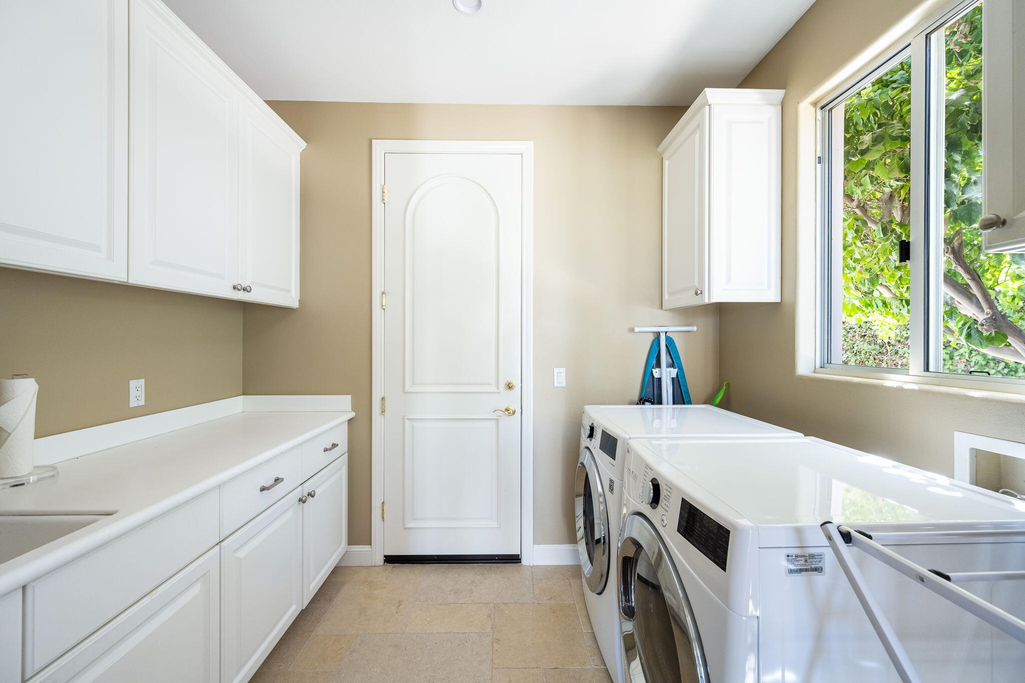 79290 Cetrino La Quinta, CA 92253 - Photo 72 of 74 a utility room with cabinets washer and dryer