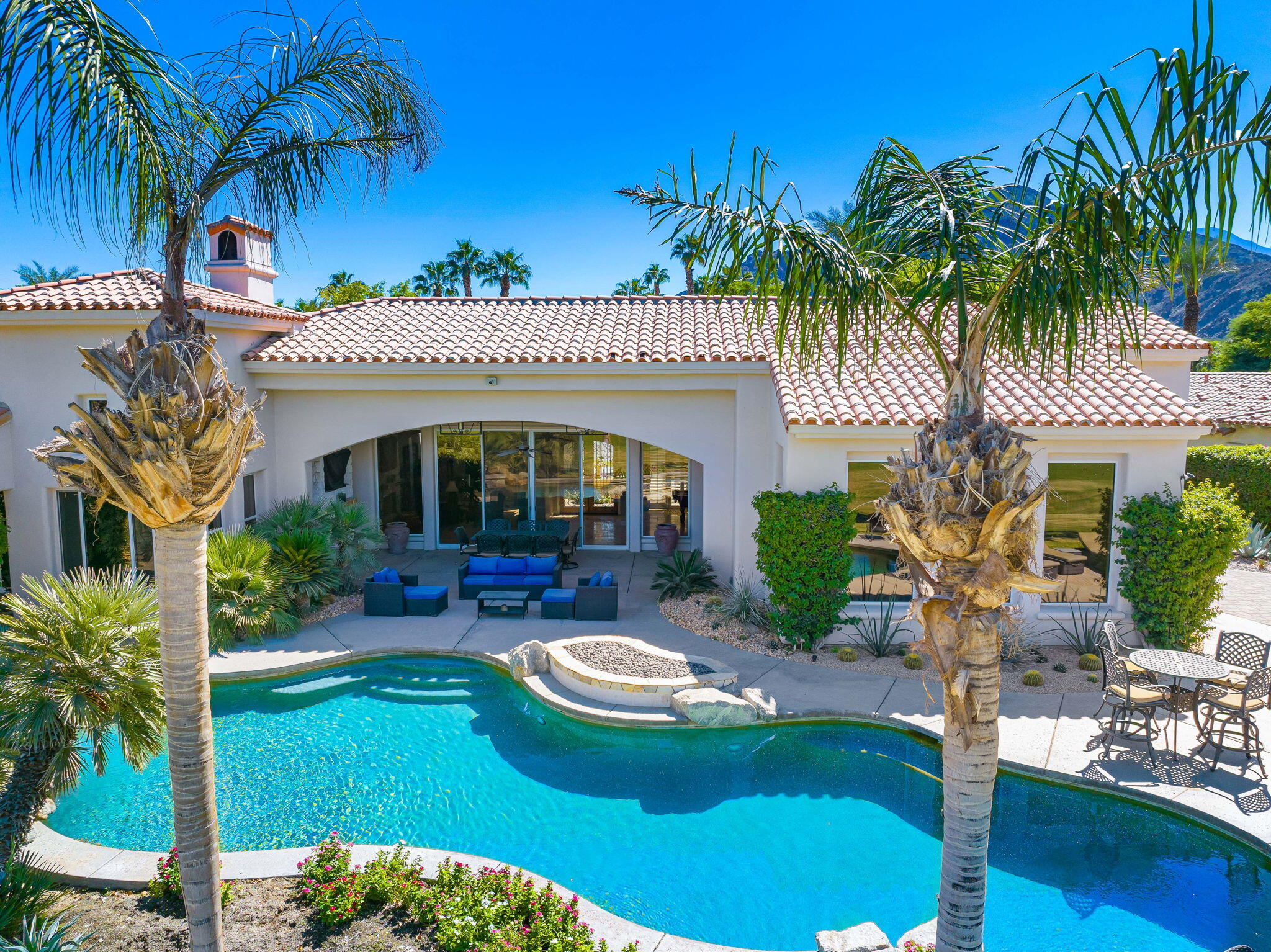 79290 Cetrino La Quinta, CA 92253 - Photo 8 of 74 a view of a house with swimming pool patio and a garden