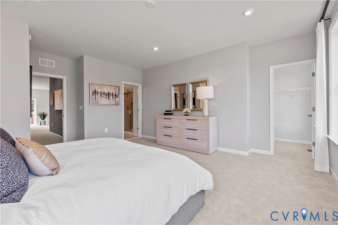 3611 Edna Path, Unit A Richmond, VA 23233 - Photo 16 of 32 a bedroom with a bed and a couch