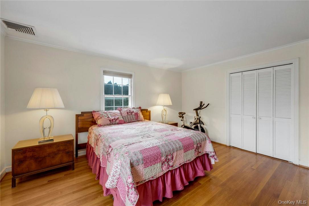 29 Old Orchard Road Rye Brook, NY 10573 - Photo 11 of 32 a bedroom with a bed and wooden floor