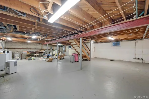 a view of empty room with wooden ceiling