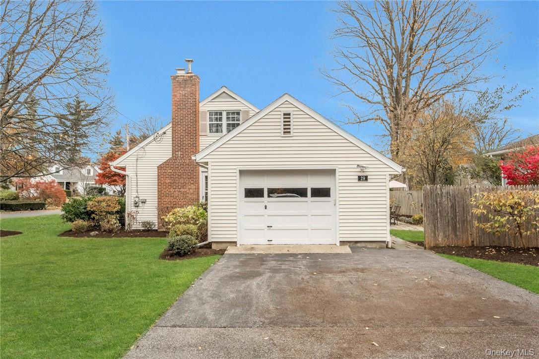 29 Old Orchard Road Rye Brook, NY 10573 - Photo 27 of 32 a view of a white house with a yard