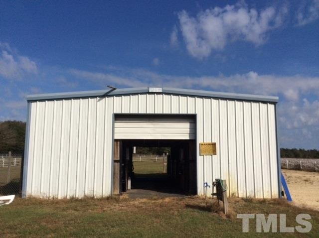 985 Mitchell Road Angier, NC 27501 - Photo 12 of 18 an empty room with windows