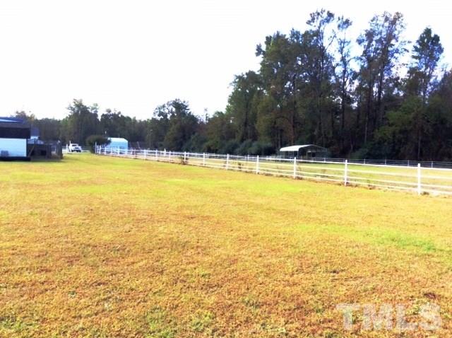 985 Mitchell Road Angier, NC 27501 - Photo 17 of 18 a view of a swimming pool and trees in the background