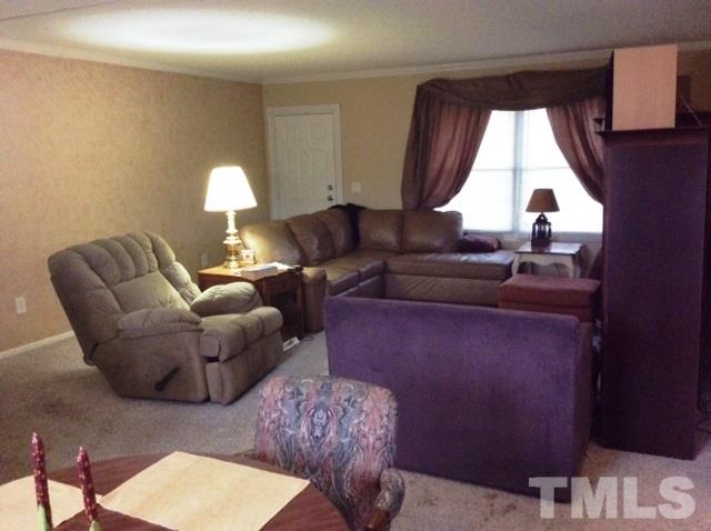 985 Mitchell Road Angier, NC 27501 - Photo 3 of 18 a living room with furniture and a window