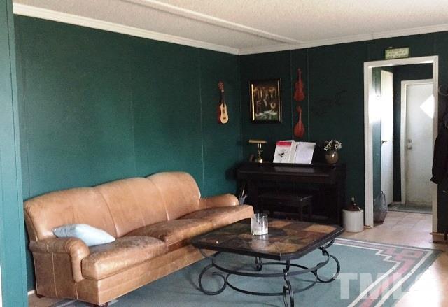 985 Mitchell Road Angier, NC 27501 - Photo 8 of 18 a living room with furniture and a wooden floor