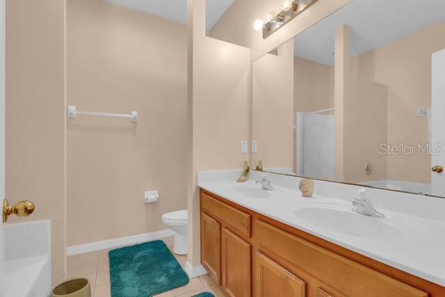 5120 Shale Ridge Trail Orlando, FL 32818 - Photo 11 of 15 a bathroom with a sink a toilet and shower