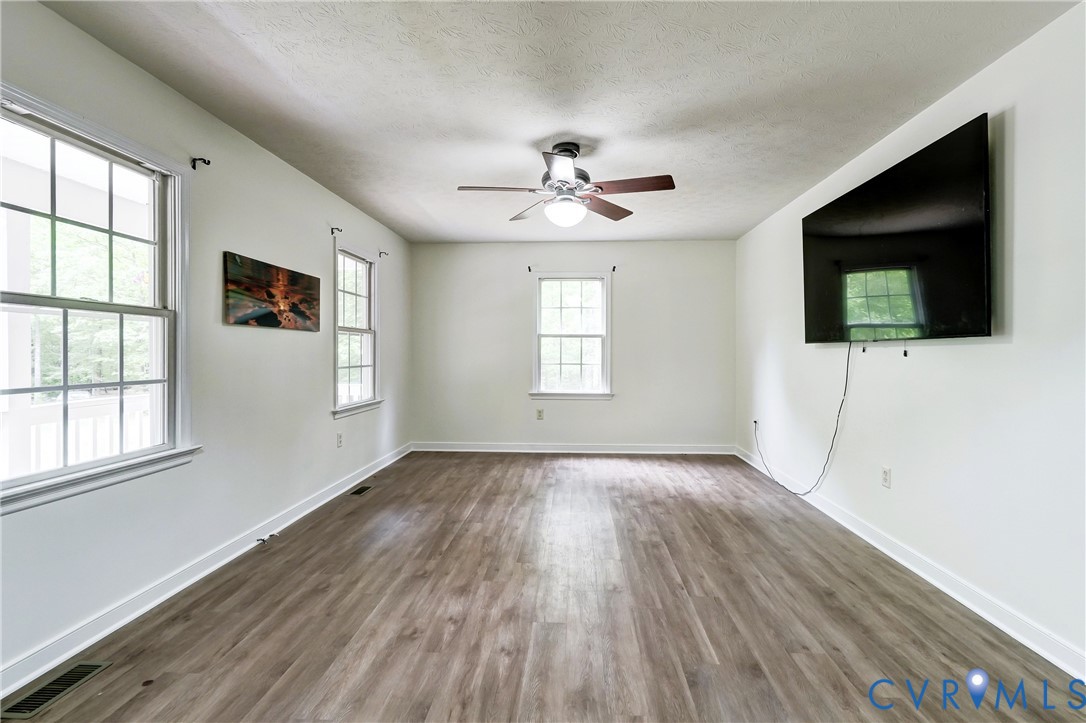 3820 Mt Pleasant Road Providence Forge, VA 23140 - Photo 9 of 40 a view of livingroom with hardwood floor and window