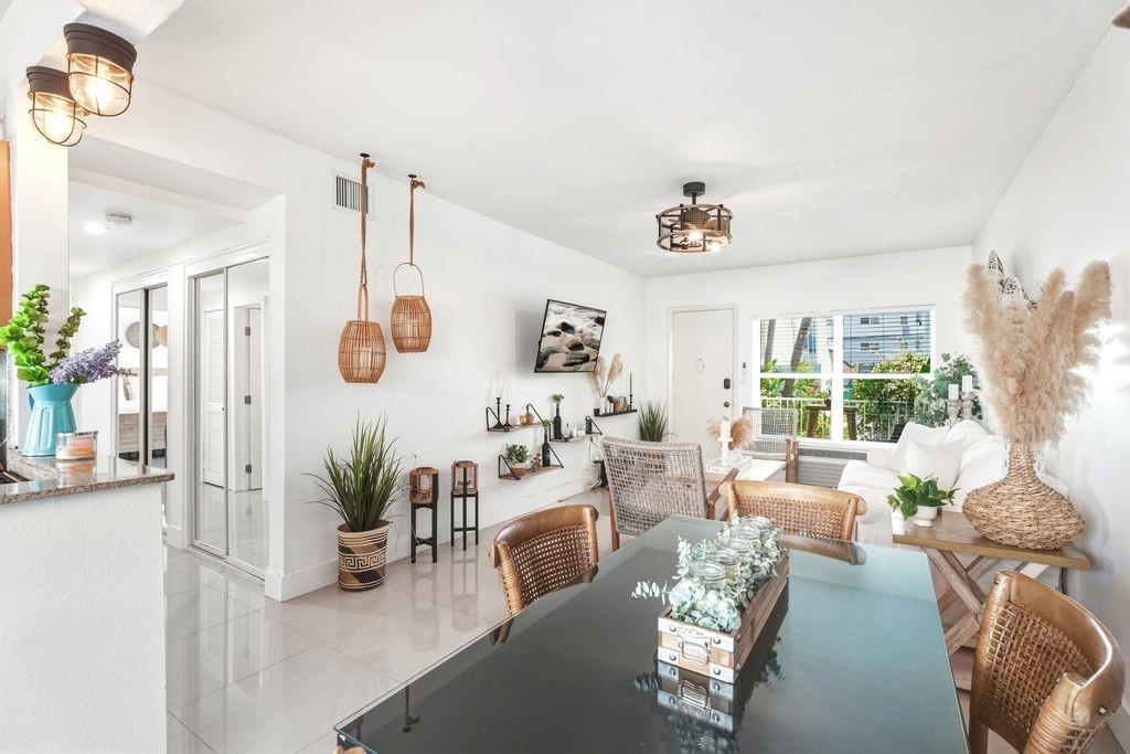 315 Van Buren Street, Unit 106B Hollywood, FL 33019 - Photo 4 of 14 Living room - dining area with open kitchen