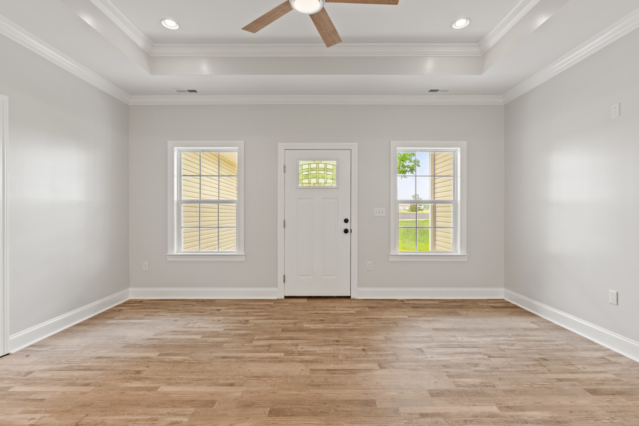 23101 Austin Whitt Road Ardmore, TN 38449 - Photo 12 of 35 an empty room with wooden floor and windows