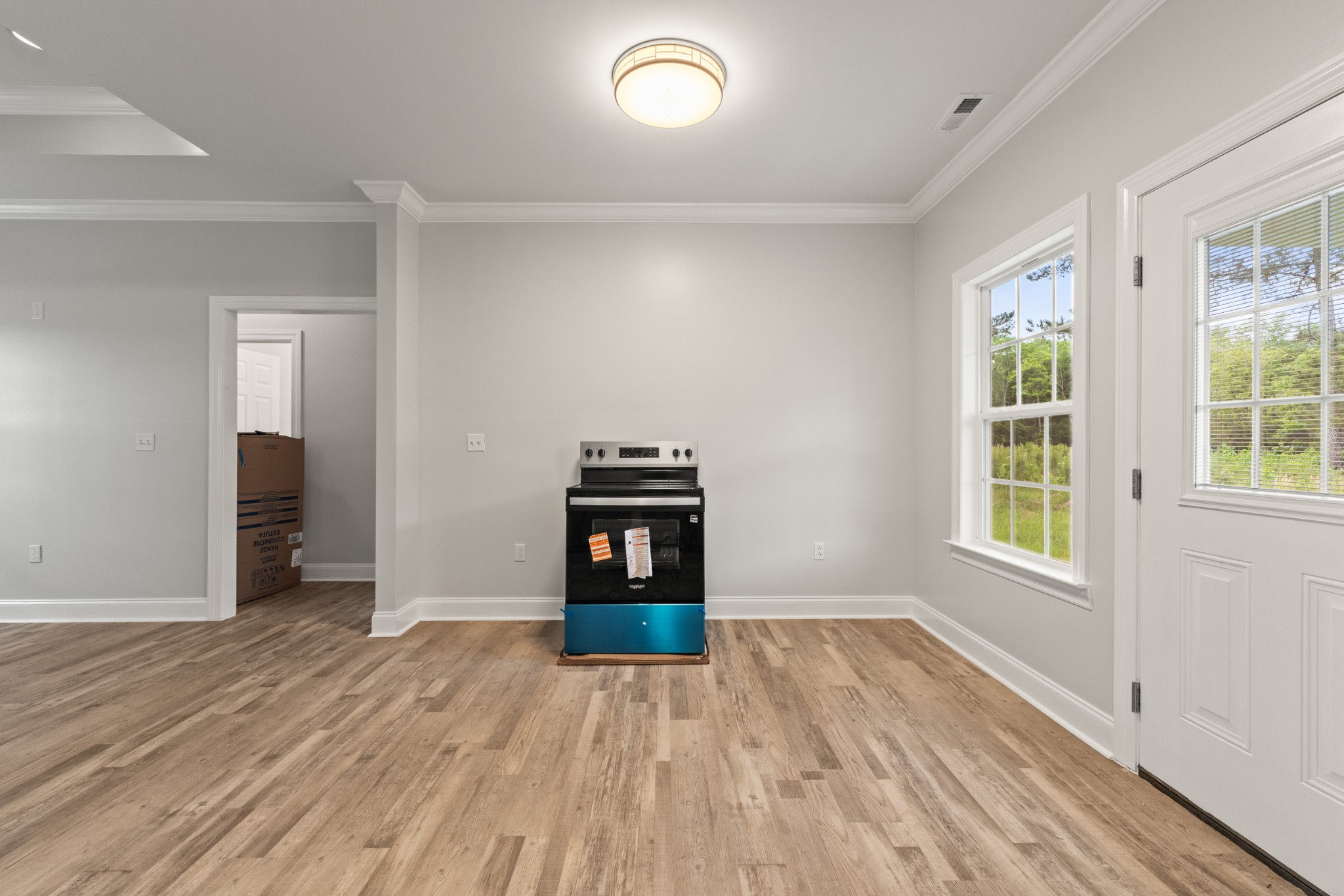 23101 Austin Whitt Road Ardmore, TN 38449 - Photo 21 of 35 a view of empty room with wooden floor and fan
