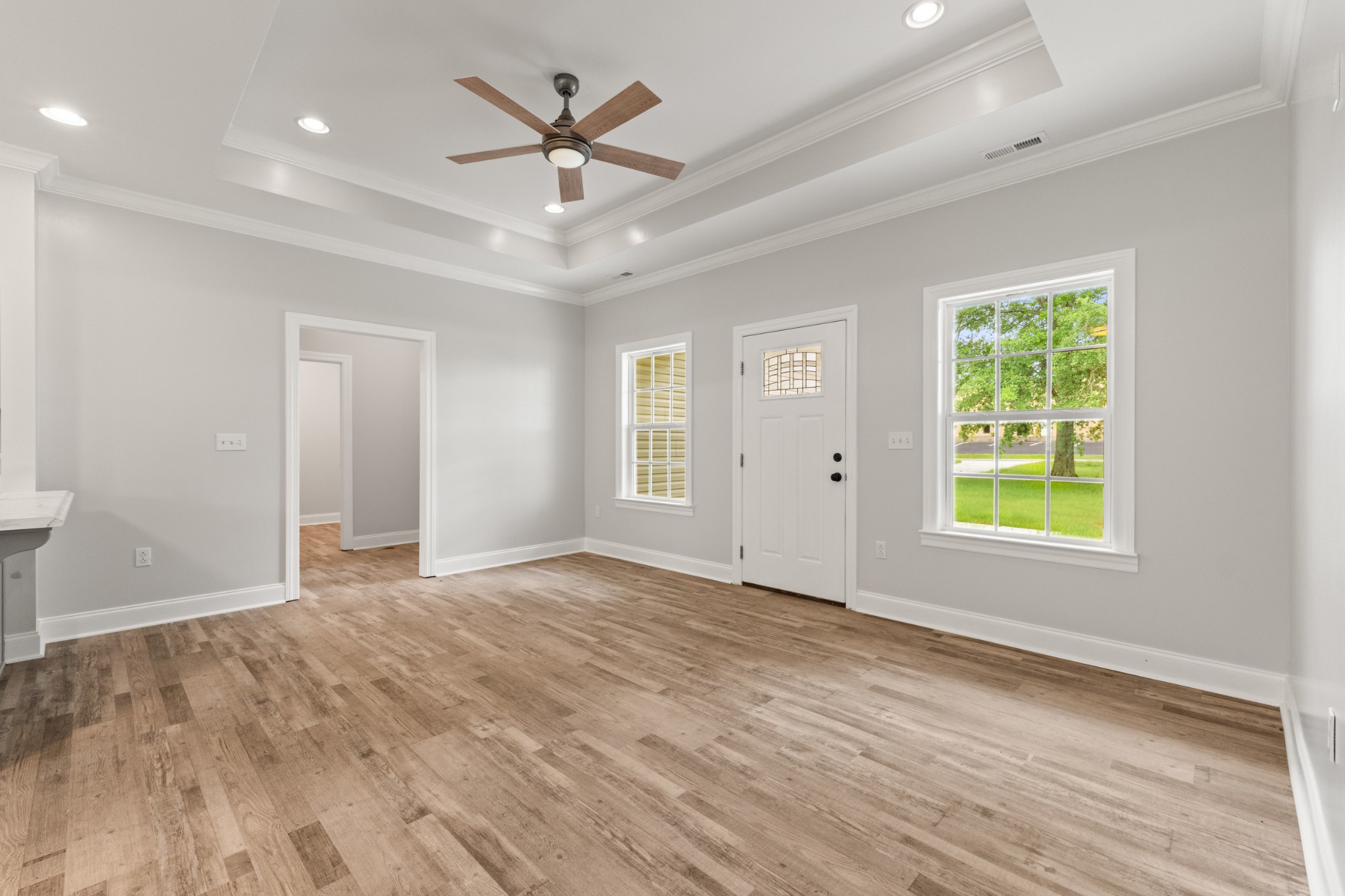 23101 Austin Whitt Road Ardmore, TN 38449 - Photo 24 of 35 a view of an empty room with a window and wooden floor