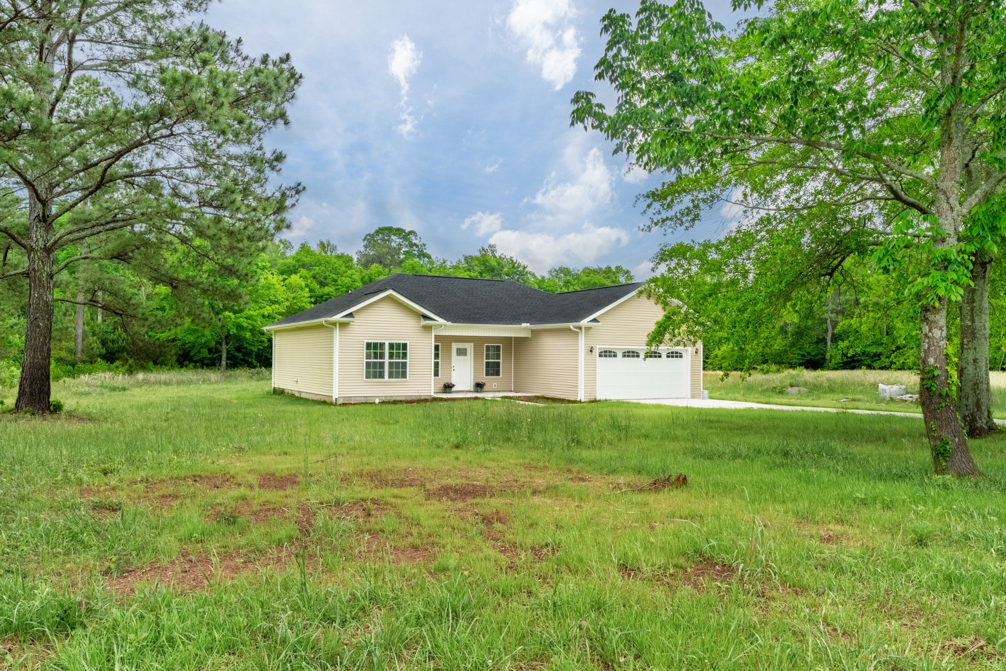 23101 Austin Whitt Road Ardmore, TN 38449 - Photo 6 of 35 a house with huge green field in front of it
