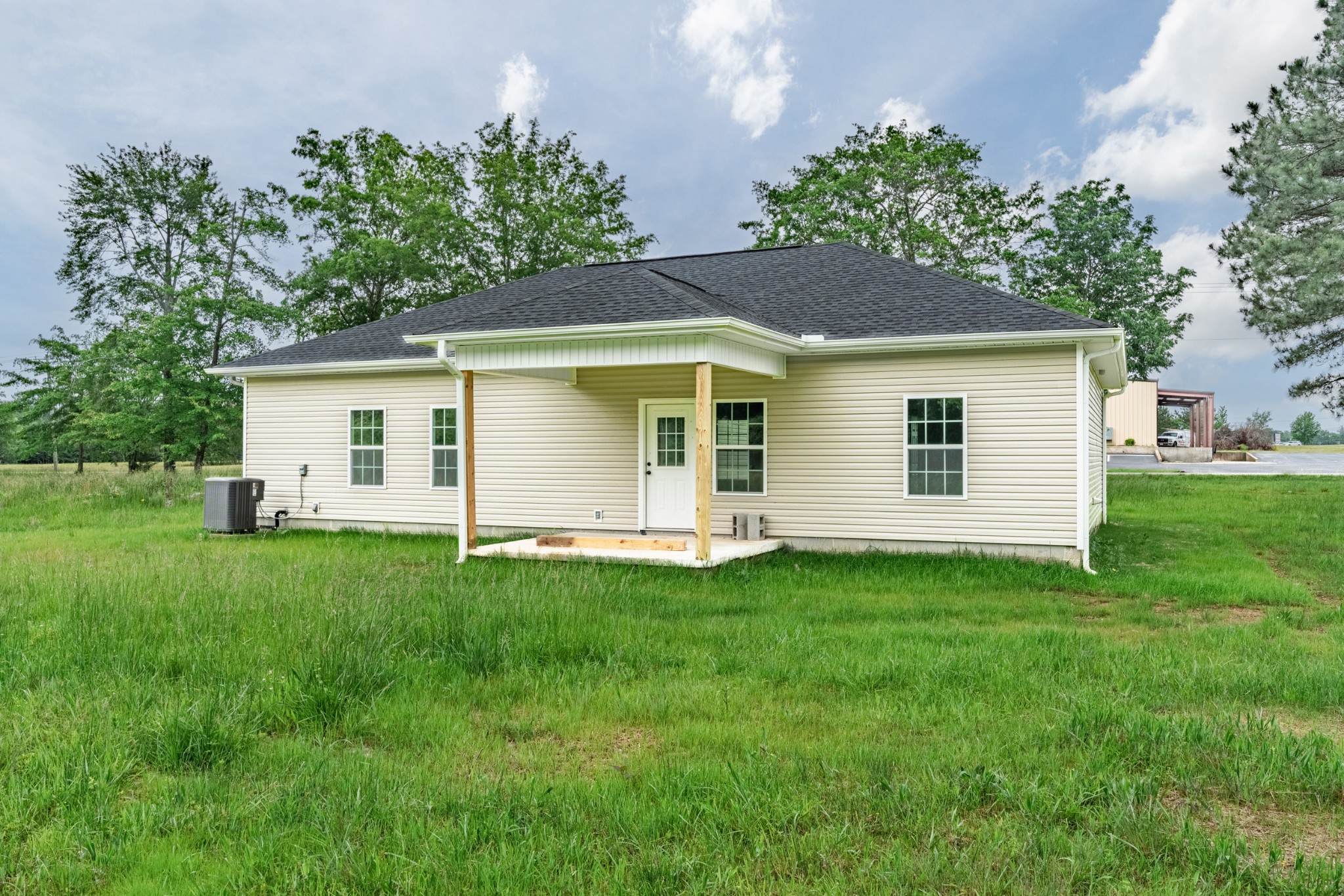 23101 Austin Whitt Road Ardmore, TN 38449 - Photo 8 of 35 a view of a house with a backyard