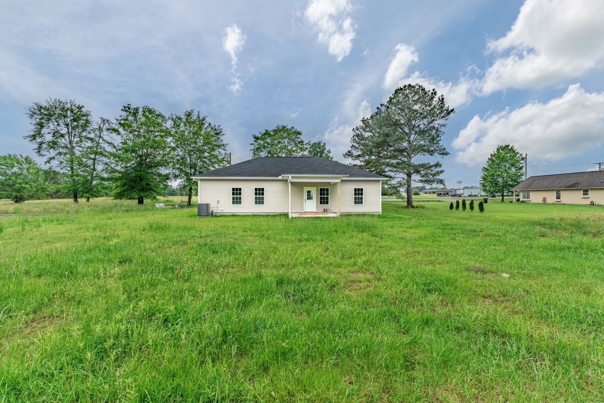 23101 Austin Whitt Road Ardmore, TN 38449 - Photo 9 of 35 a front view of a house with garden