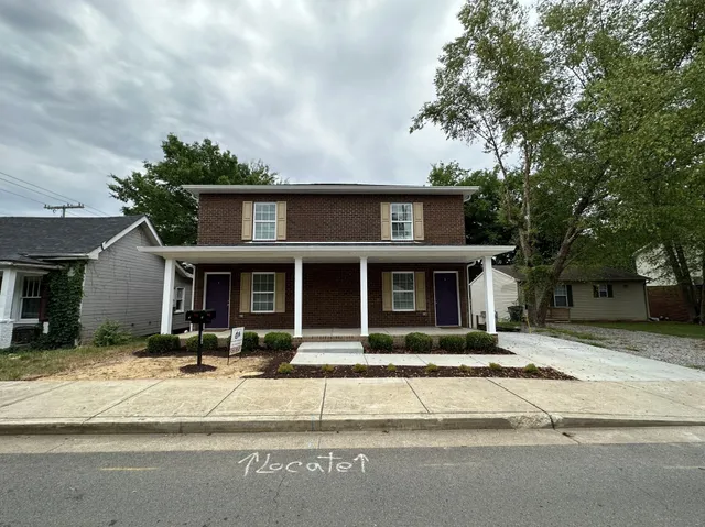 a front view of a house with a patio