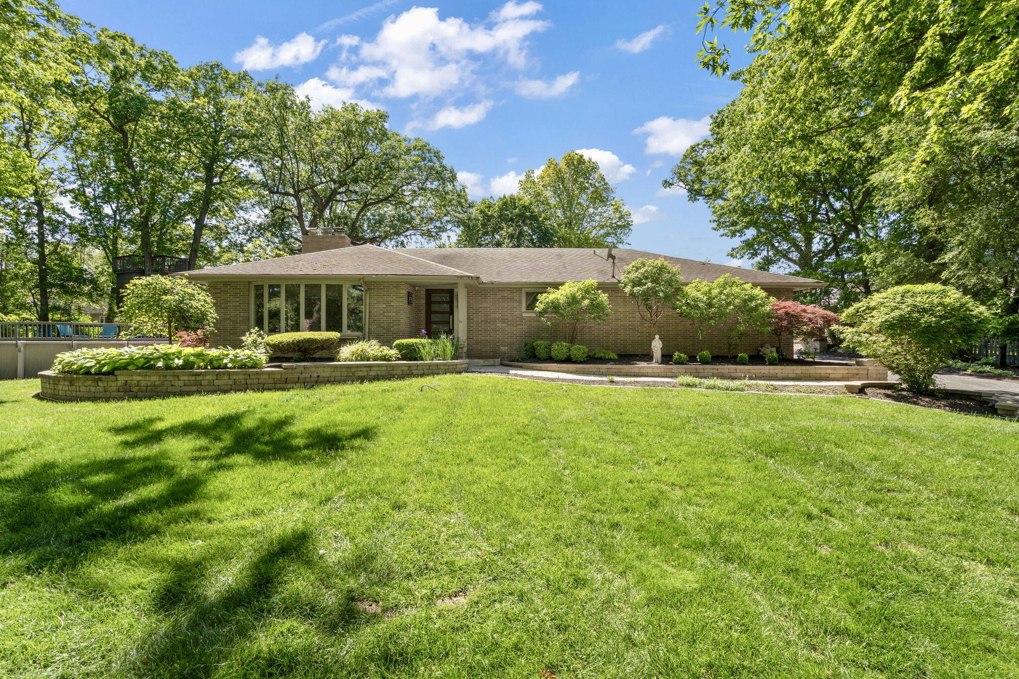 11728 Monroe Place Crown Point, IN 46307 - Photo 1 of 44 a front view of a house with garden