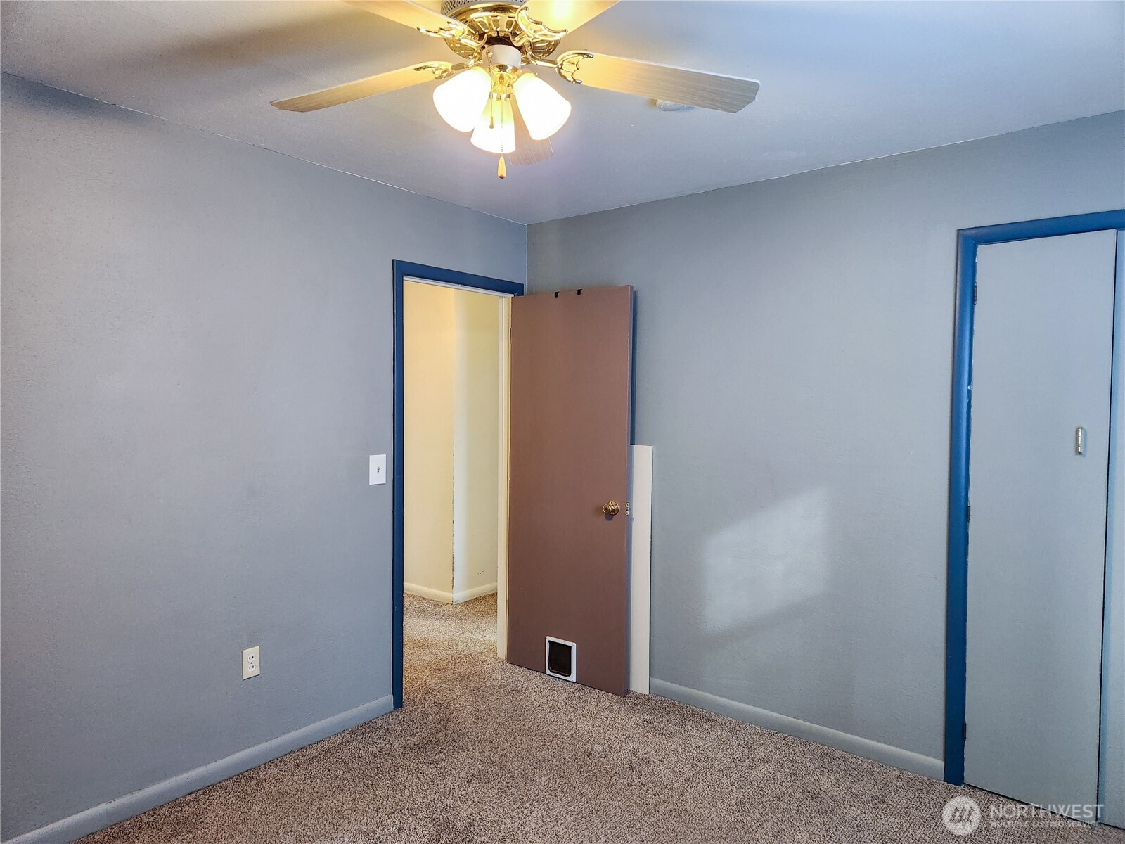 107 West 9th Avenue Ritzville, WA 99169 - Photo 14 of 26 an empty room with closet and a chandelier fan