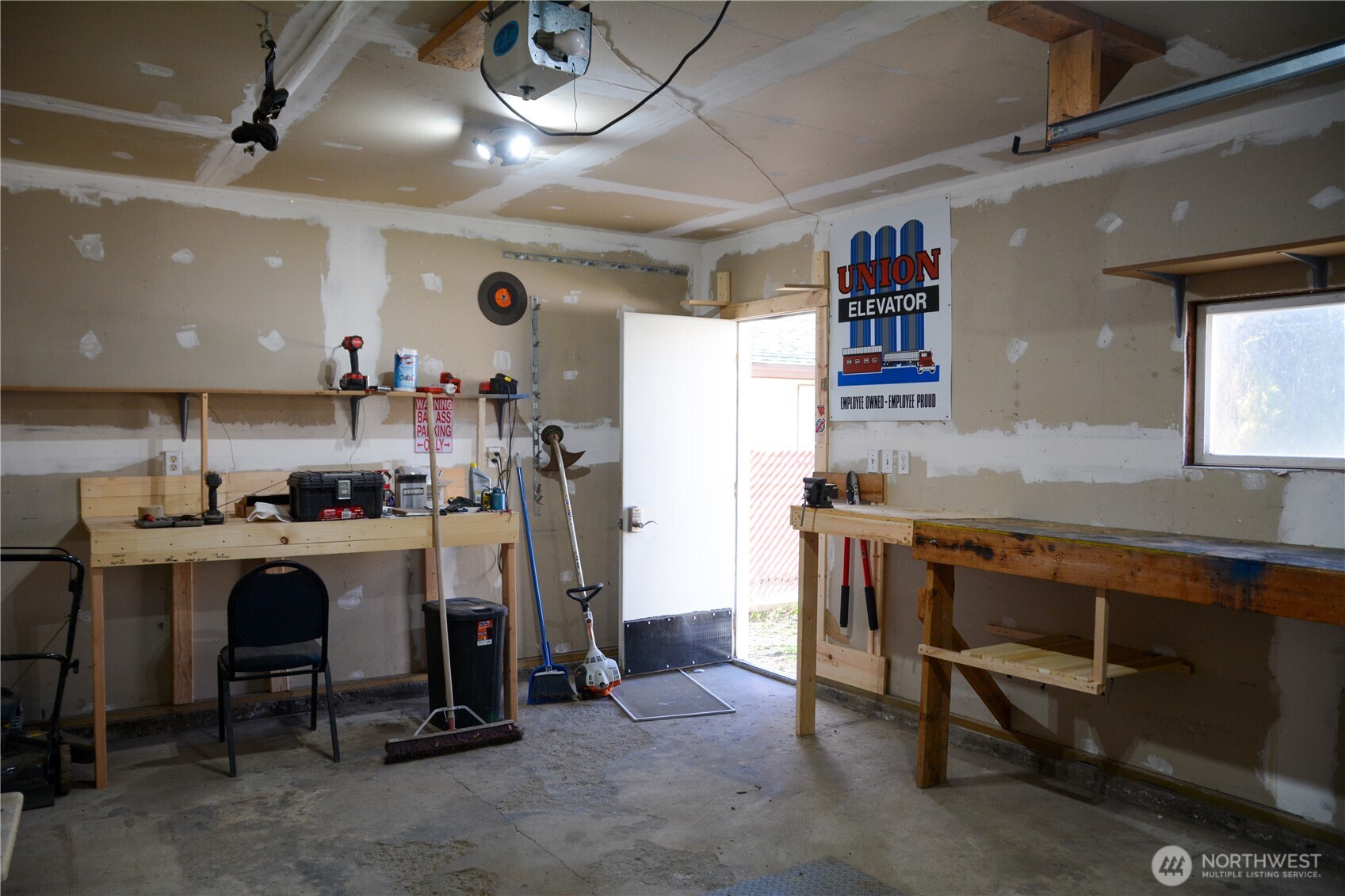 107 West 9th Avenue Ritzville, WA 99169 - Photo 25 of 26 a room with stainless steel appliances kitchen island granite countertop furniture and a refrigerator
