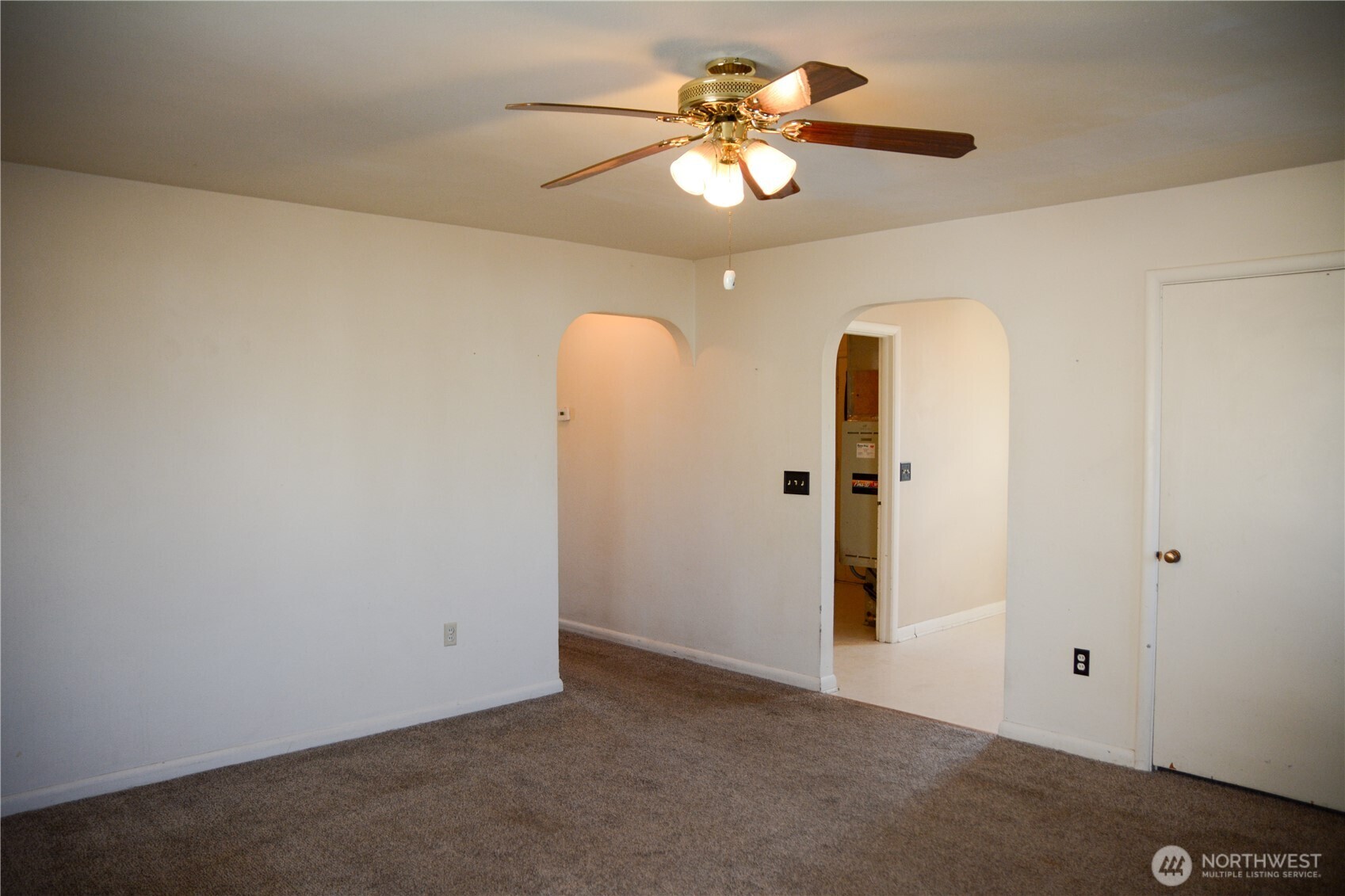107 West 9th Avenue Ritzville, WA 99169 - Photo 4 of 26 wooden floor in an empty room with a window