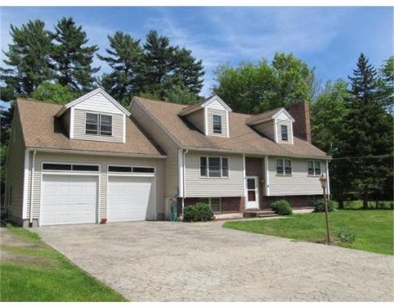 8 Fredrickson Road Billerica, MA 01821 - Photo 1 of 16 a front view of a house with a yard and garage