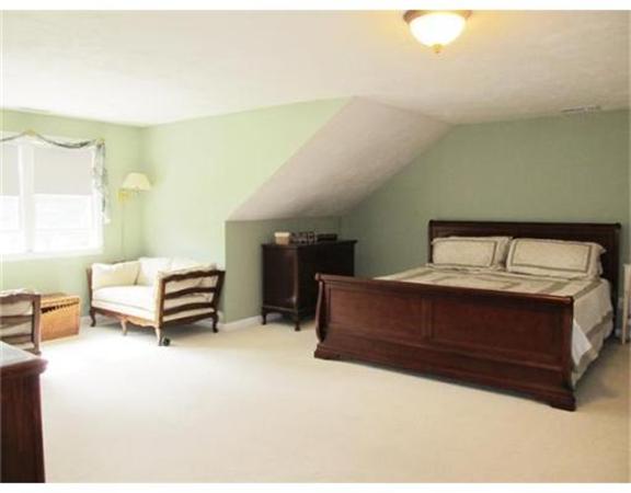8 Fredrickson Road Billerica, MA 01821 - Photo 11 of 16 a bedroom with a bed and a chandelier