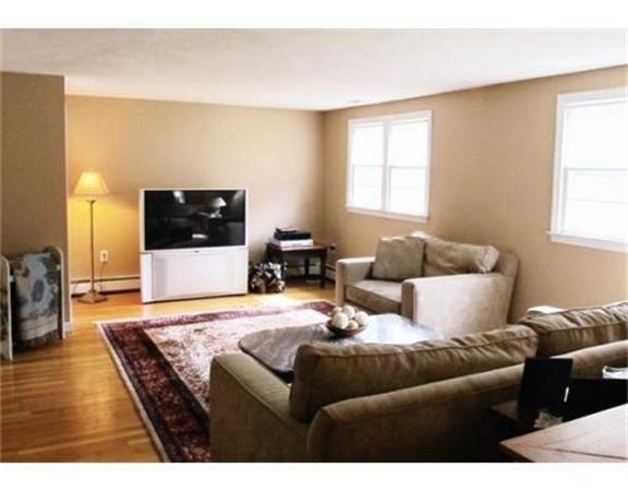 8 Fredrickson Road Billerica, MA 01821 - Photo 4 of 16 a living room with furniture and a flat screen tv