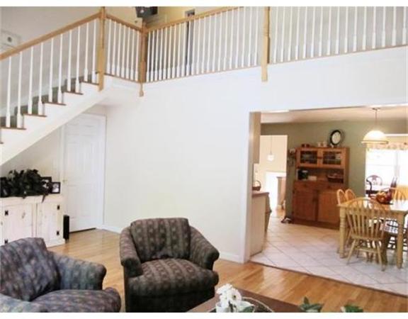 8 Fredrickson Road Billerica, MA 01821 - Photo 9 of 16 a living room with furniture and stairs