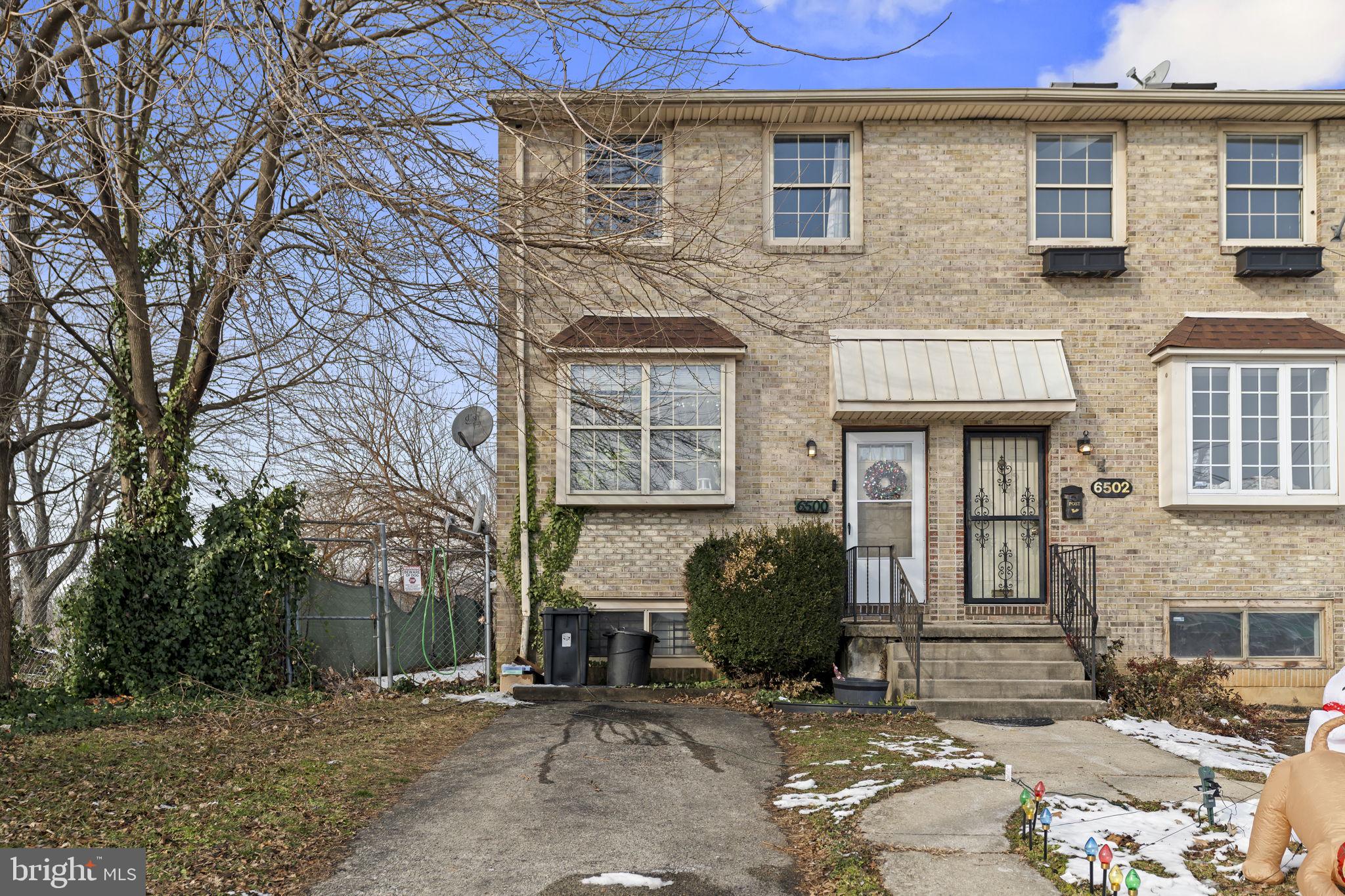 6500 Ditman Street Philadelphia, PA 19135 - Photo 1 of 30 a front view of a house with a yard