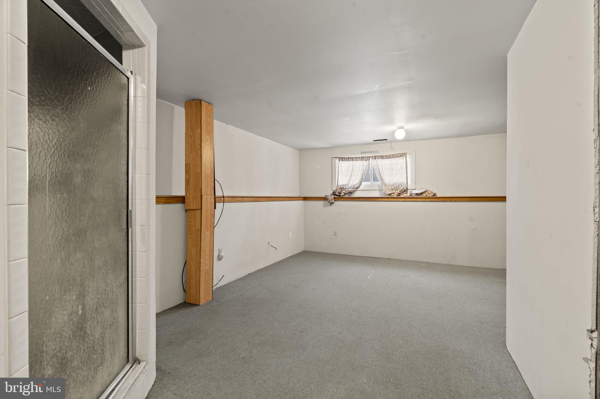 6500 Ditman Street Philadelphia, PA 19135 - Photo 25 of 30 a view of a room with a refrigerator and white cabinets