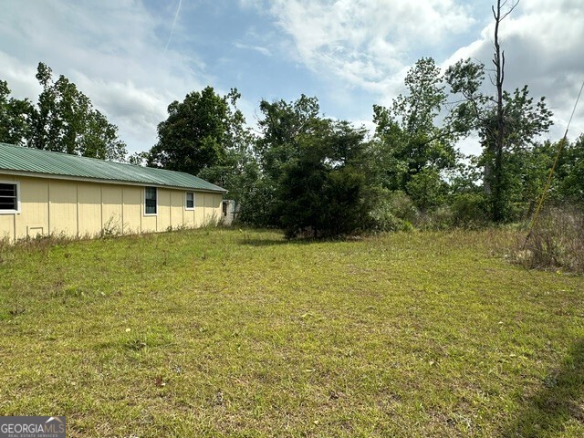 308 Three Rivers Lane Uvalda, GA 30473 - Photo 21 of 28 a view of a house with a yard