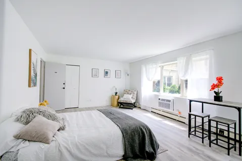 a bedroom with a bed and a table