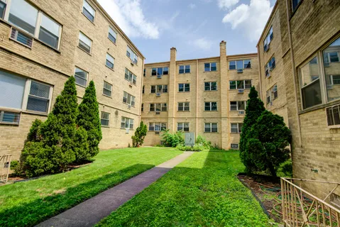 a view of a building with a yard