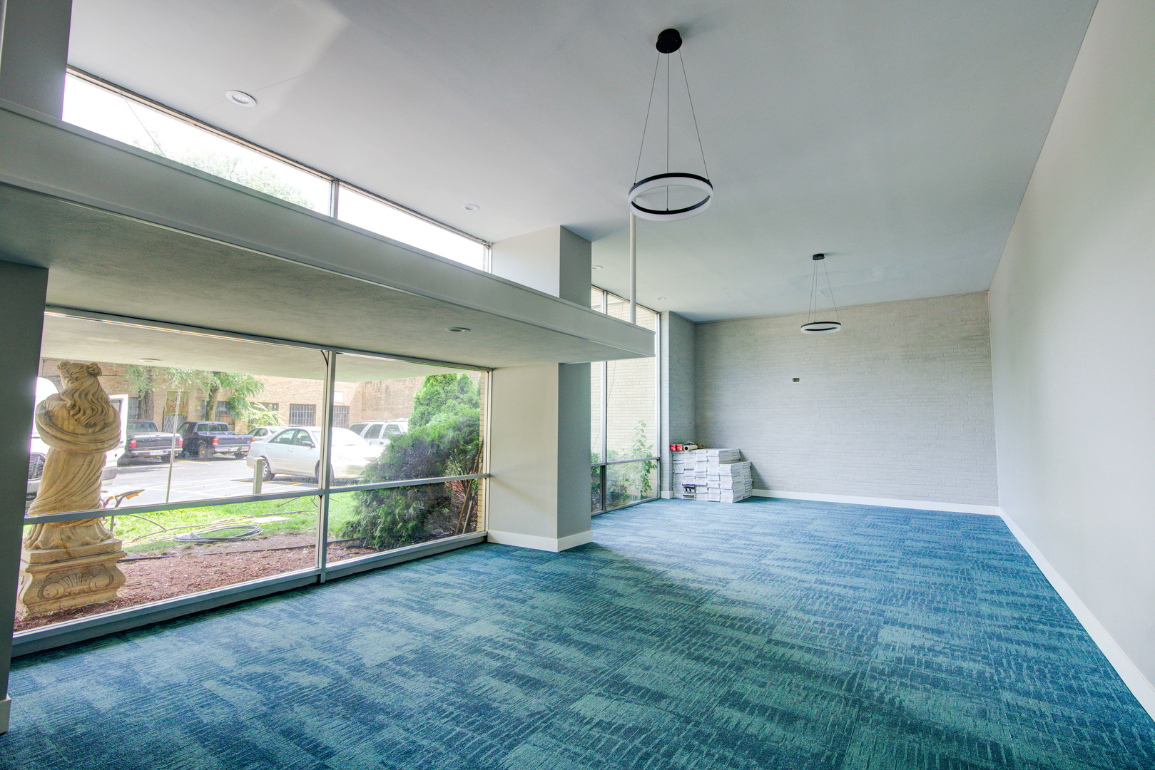 7250 North Western Avenue, Unit 306 Chicago, IL 60645 - Photo 5 of 17 an empty room with windows and outdoor view