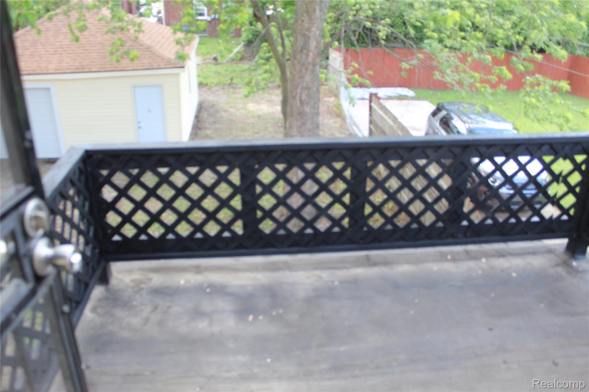 5543 Balfour Road Detroit, MI 48224 - Photo 43 of 54 Balcony featuring black lattice railing